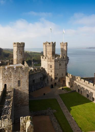 View of Eagle Tower Caernarfon Castle with flags