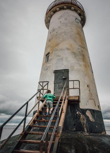 Jude Rogers' son exploring Point of Ayr Lighthouse.