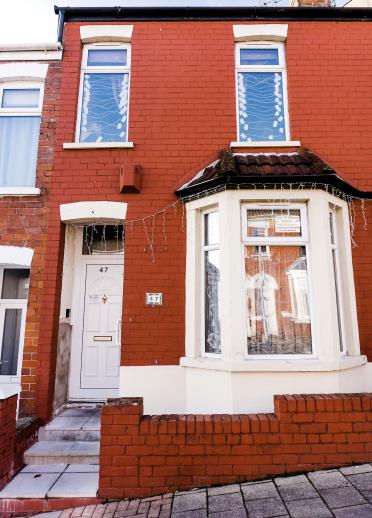 Exterior of a red brick terraced house in Barry.