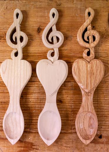 Three lovespoons with a treble clef carving.