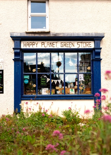 A blue framed paned glass shop window.