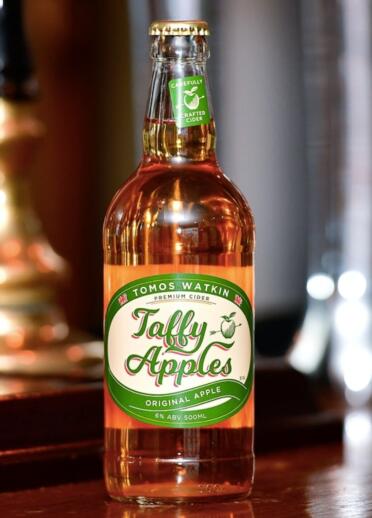 Bottle of cider labelled Tomos Watkin Taffy Apples.