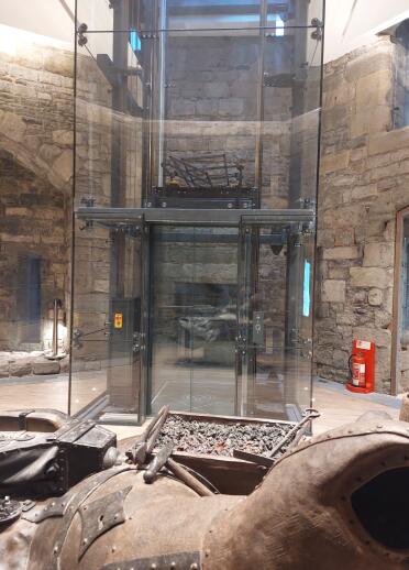 glass lift inside castle.