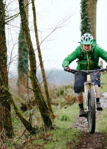 A mountain biker heading down a trail.