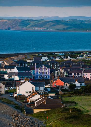 View of Aberaeron and its colourful houses in front of the sea.