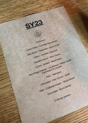A printed menu on a table.