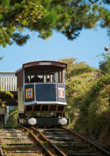 Tram carrying passengers down the hillside to Aberystwyth beach.