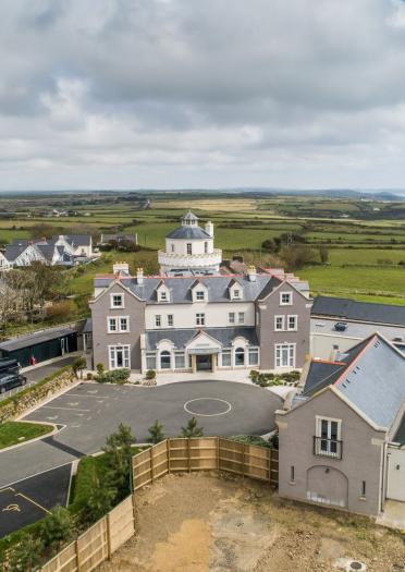 An aerial shot of Twr y Felin Hotel with the Pembrokeshire coast in the background.