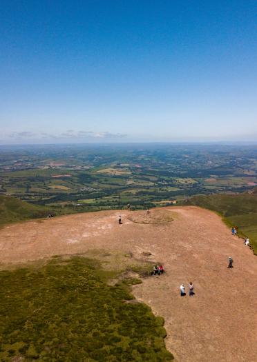 Spectacular viewof the green pastures below from the summit of Pen y Fan, Brecon Beacons.
