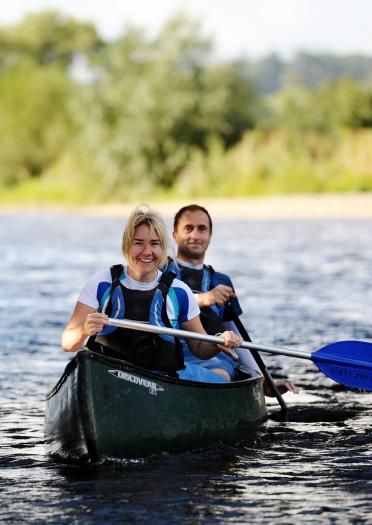 Two people canoeing in the Wye Valley