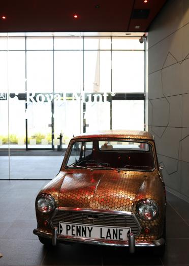 Mini car adorned with coins at the Royal Mint Expericence.