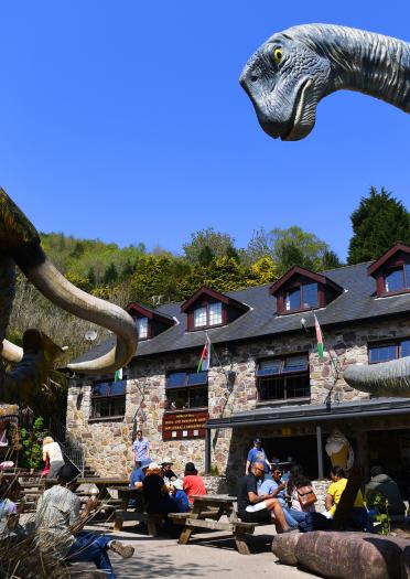 Dinosaur and a woolly mammoth by the cafe at Dan yr Ogof caves.