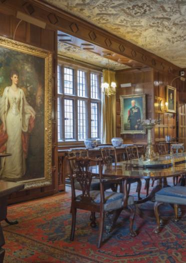 Dining Room in castle. Portrait of Violet Lane Fox, Countess of Powis by Ellis Roberts to the left.