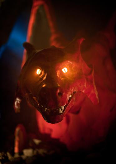 Face of red dragon with eyes lit up