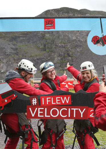Four people taking a selfie at Zip World Velocity.