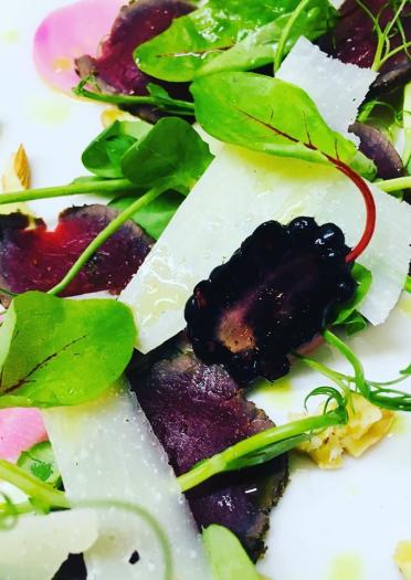 Shaved cheese, beetroot and green leaf salad. 