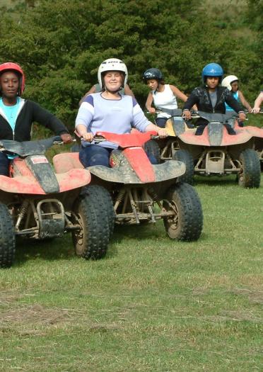 young people on quad bikes.