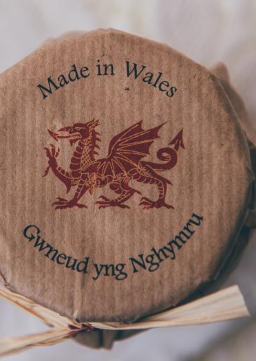 Label on top of a honey jar. Text says 'Made in Wales'.