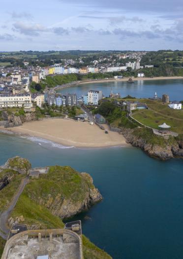 Aerial view of Tenby showing beaches, town and island.