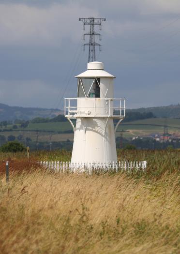A white painted lighthouse. 