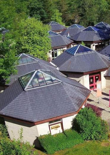 aerial view of buildings with glass roofs.