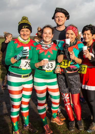 group of people in festive running costumes.