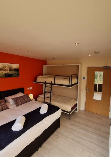 bedroom with double bed and bunk bed.