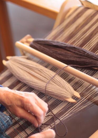 woman weaving.