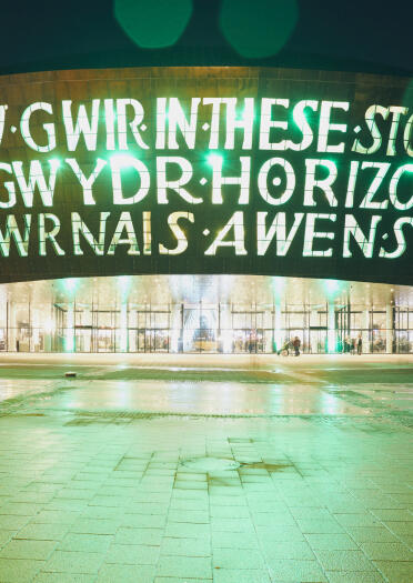 Exterior of Wales Millennium Centre at night.