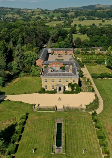 aerial view of stately home and gardens.