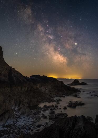 Milky Way above coast.