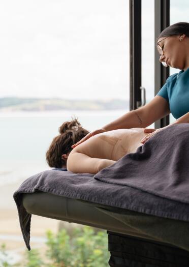 woman receiving back massage.