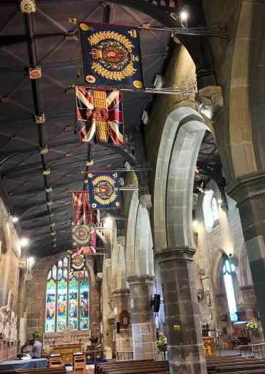 Interior of church with flags.
