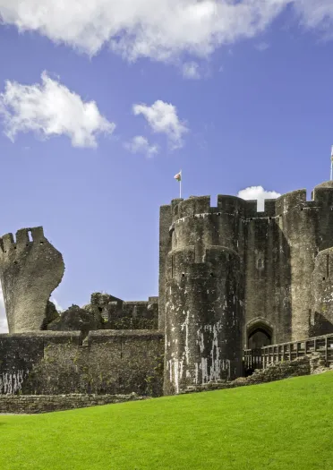 castle with leaning tower on a sunny day.