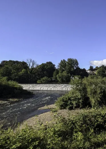 A wide weir across a river.
