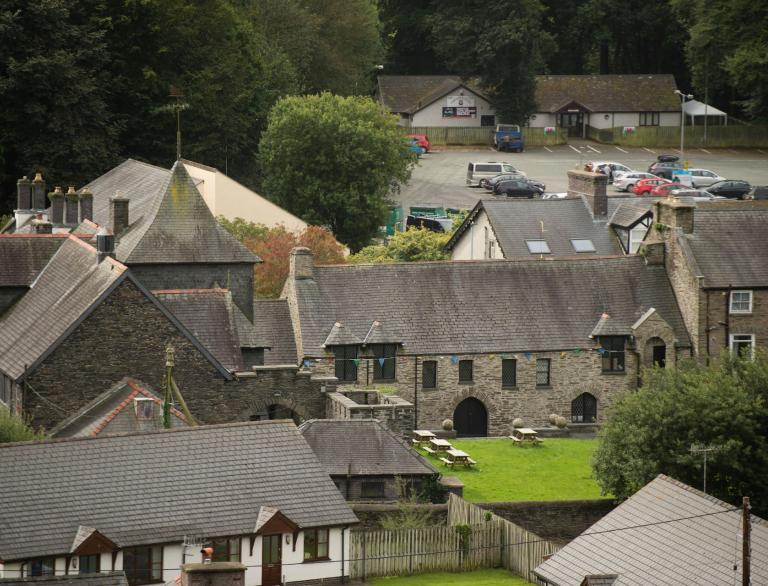 A shot from above of the back of  Owain Glyndŵr Centre and lawns.