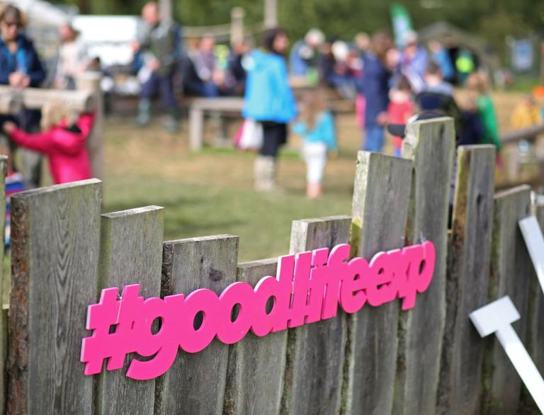 #goodlifeexp hashtag sign on fence.