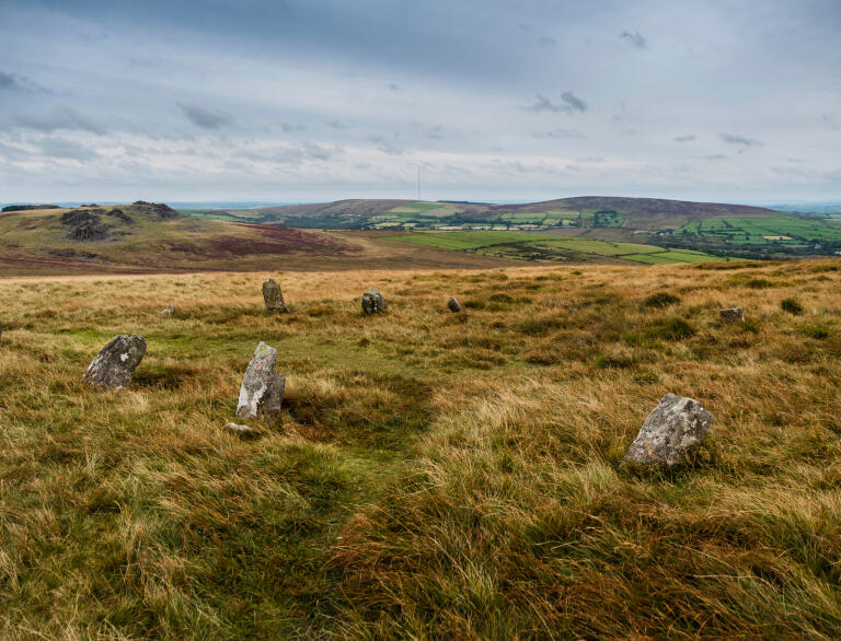 A collection of Neolithic stones on the Preseli Hills, looking over to Carn Menyn peak