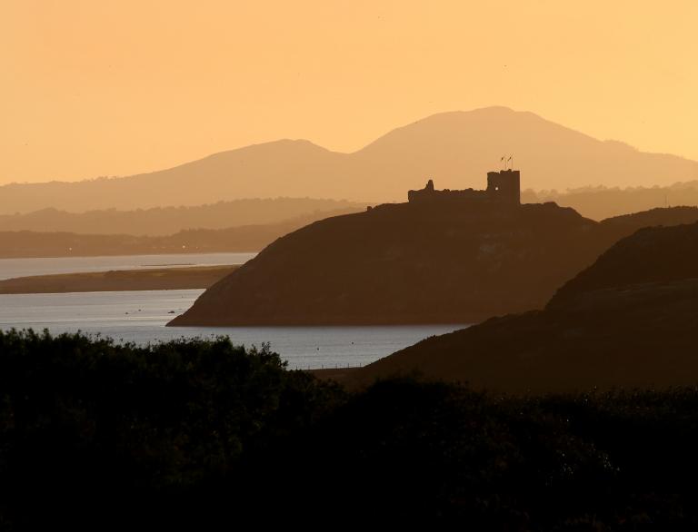 Criccieth Castle, with Snowdonia in the background.