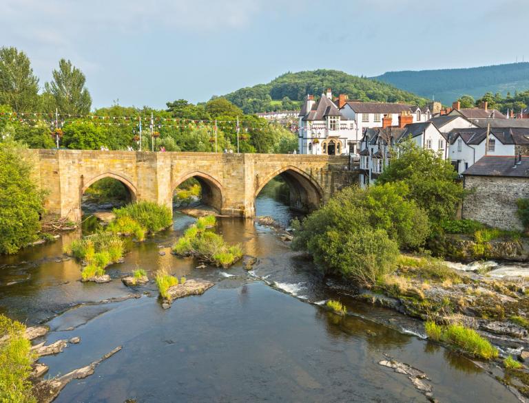 View of Llangollen bridge leading into the town from the river Dee.