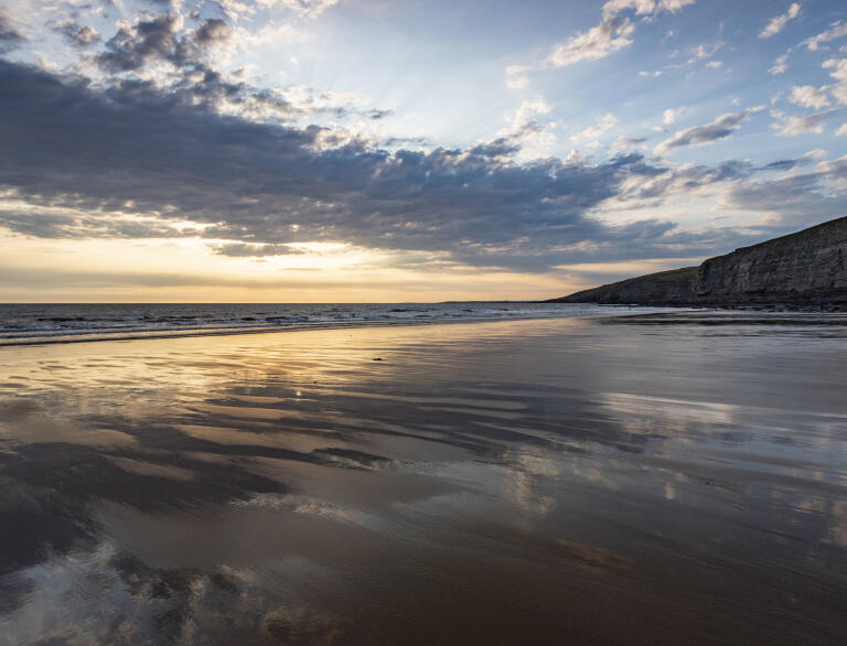 Tide out at Southerndown beach at sunset.