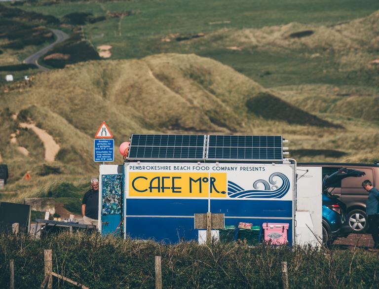 Cafe Mor van with hills in background.