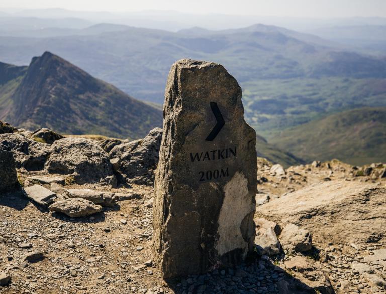 Watkin Path stone directional marker post.