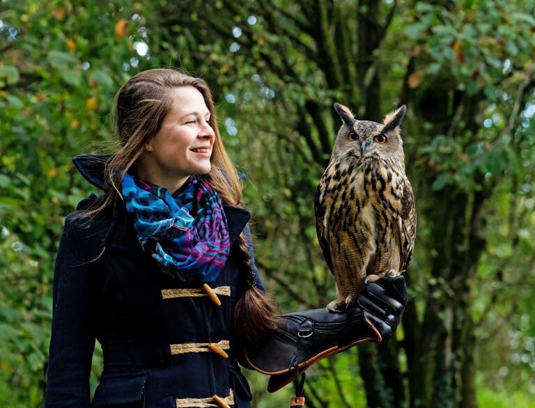 woman holding owl.