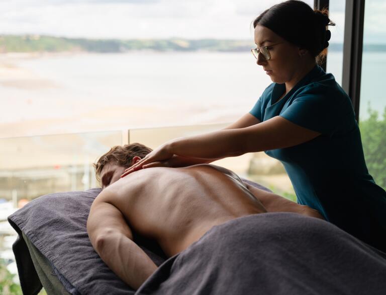 man receiving back massage.