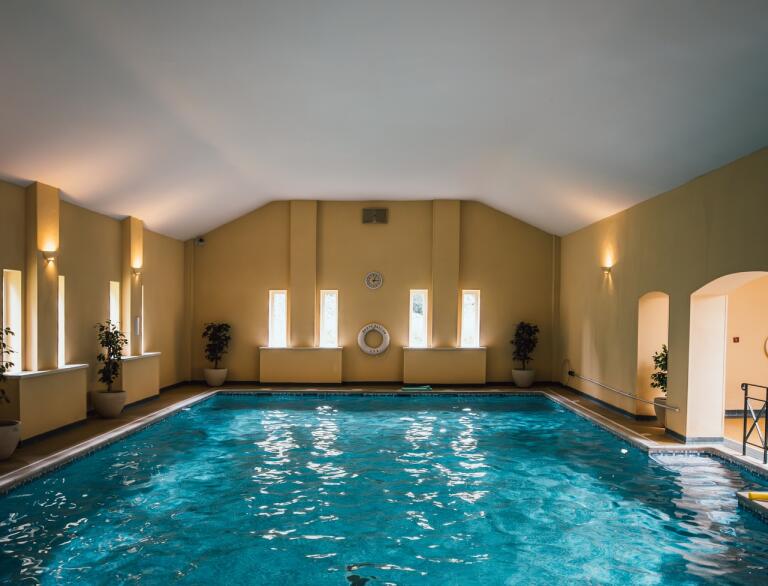 An indoor swimming pool and spa area.