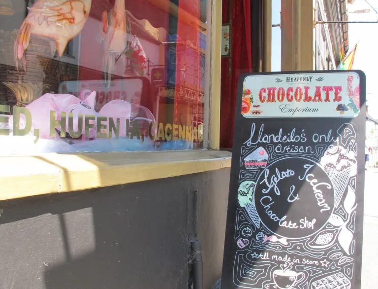 window display and sign outside chocolate shop.