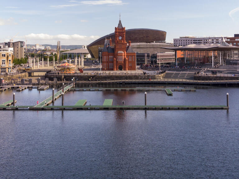 Landscape of the attractions at Cardiff Bay seen from the water.