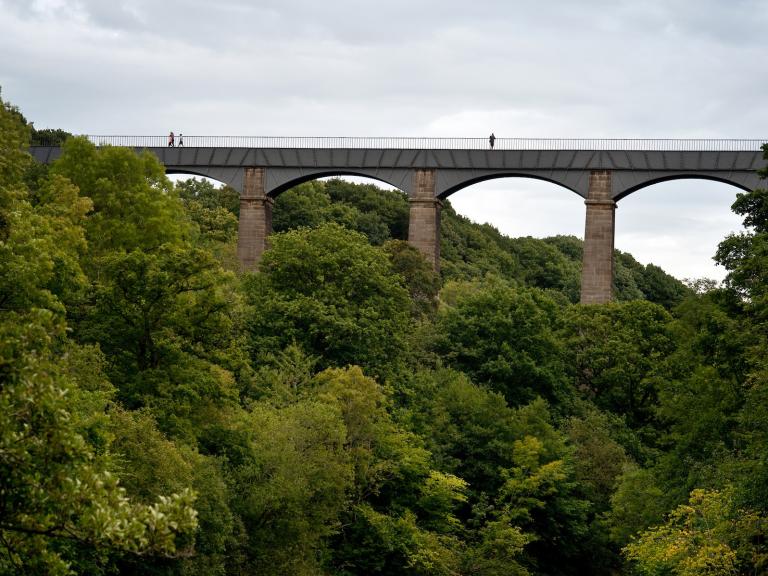 Image of the aqueduct and trees and river below