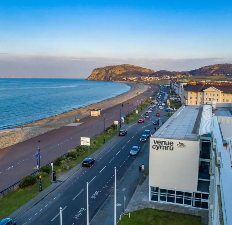 A theatre alongside the promenade with views of the coast.